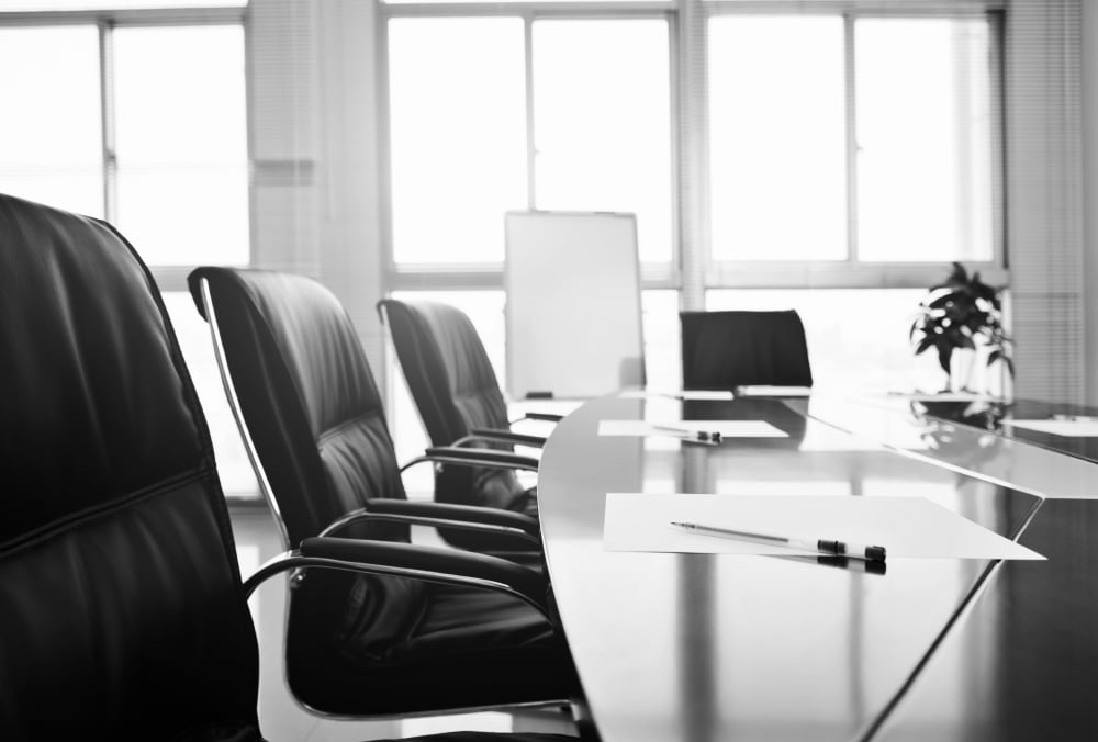 Meeting room with office chairs and desk