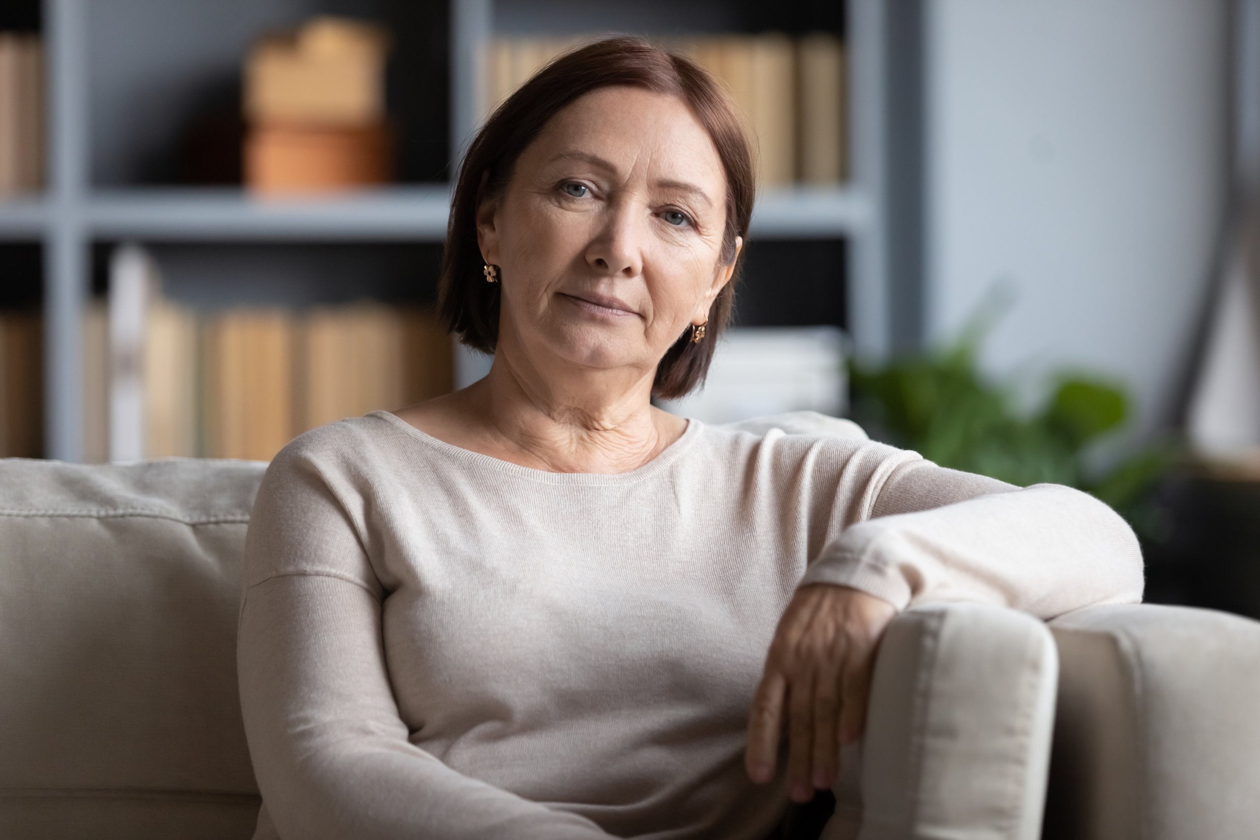 Older woman with short hair looking into camera