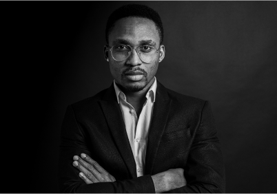 Man wearing suit and glasses in black and white