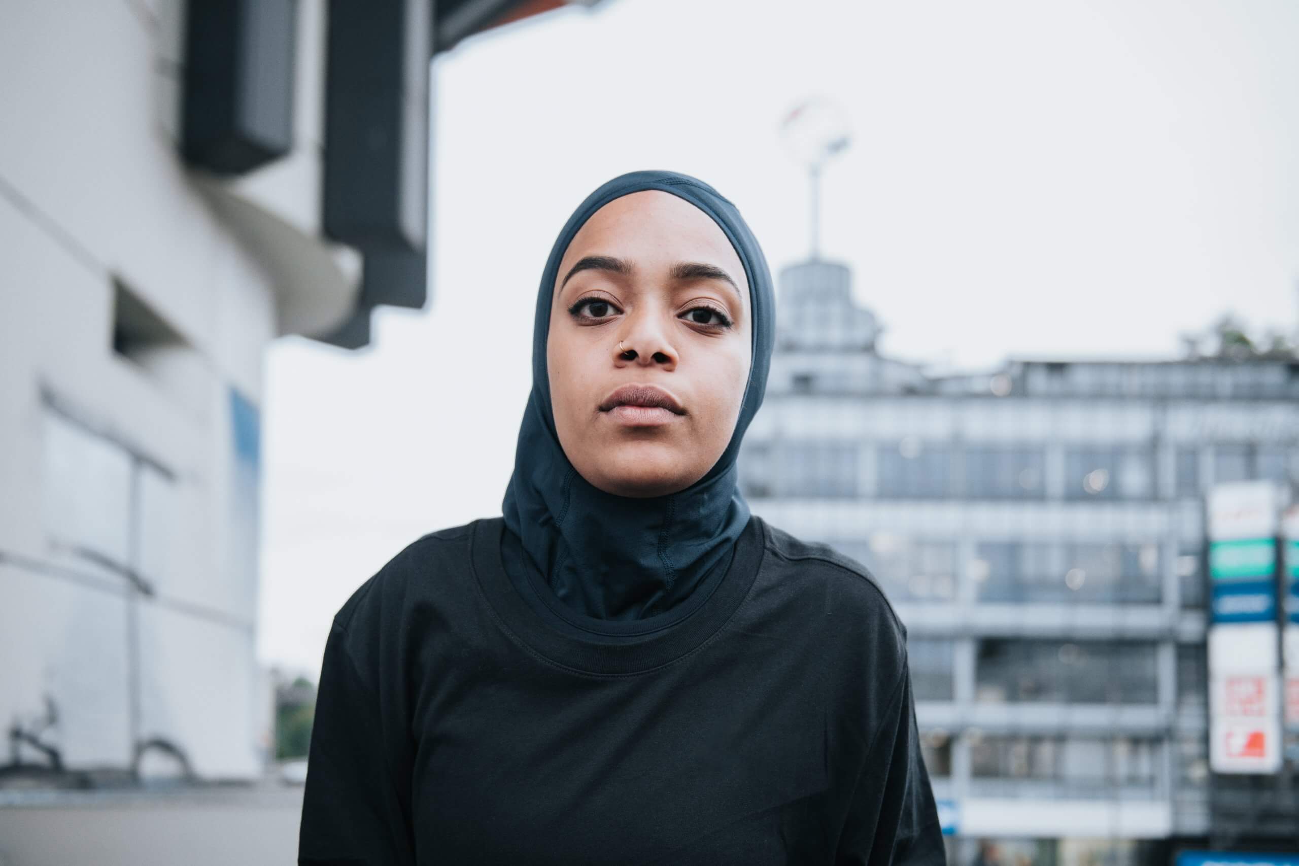 Woman wearing hijab looking into camera